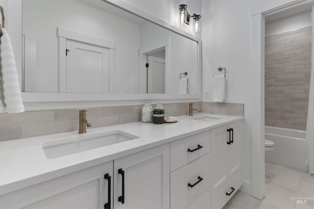 125 S Eagles Roost Way, Eagle, ID 83616 - bathroom with double vanity, decorative backsplash, and bathing tub / shower combination