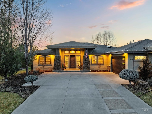 prairie-style house featuring a garage