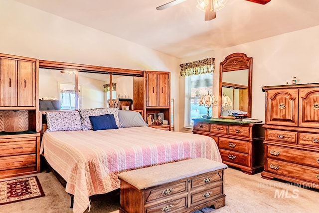12 Blue Spruce Ct, Cascade, ID 83611 - bedroom featuring light carpet, lofted ceiling, and a ceiling fan