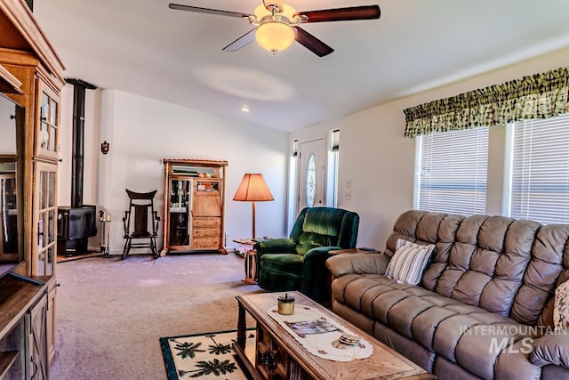 12 Blue Spruce Ct, Cascade, ID 83611 - carpeted living room featuring a ceiling fan and a wood stove