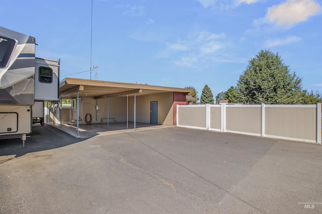 exterior space featuring a carport