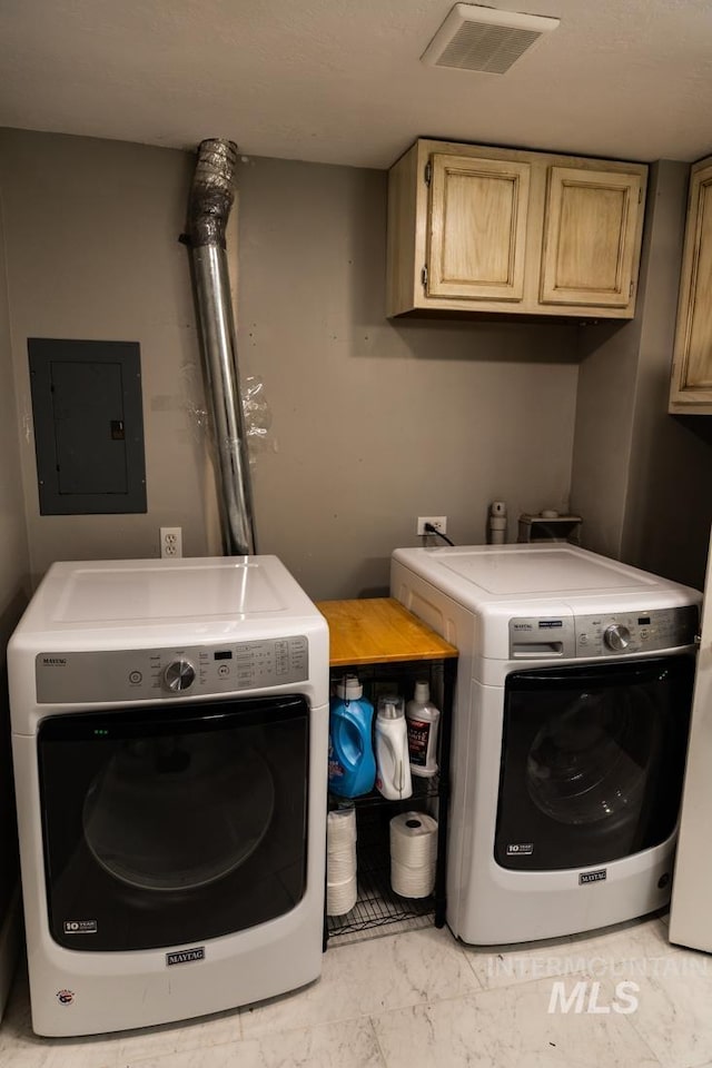 laundry room with visible vents, marble finish floor, independent washer and dryer, electric panel, and cabinet space