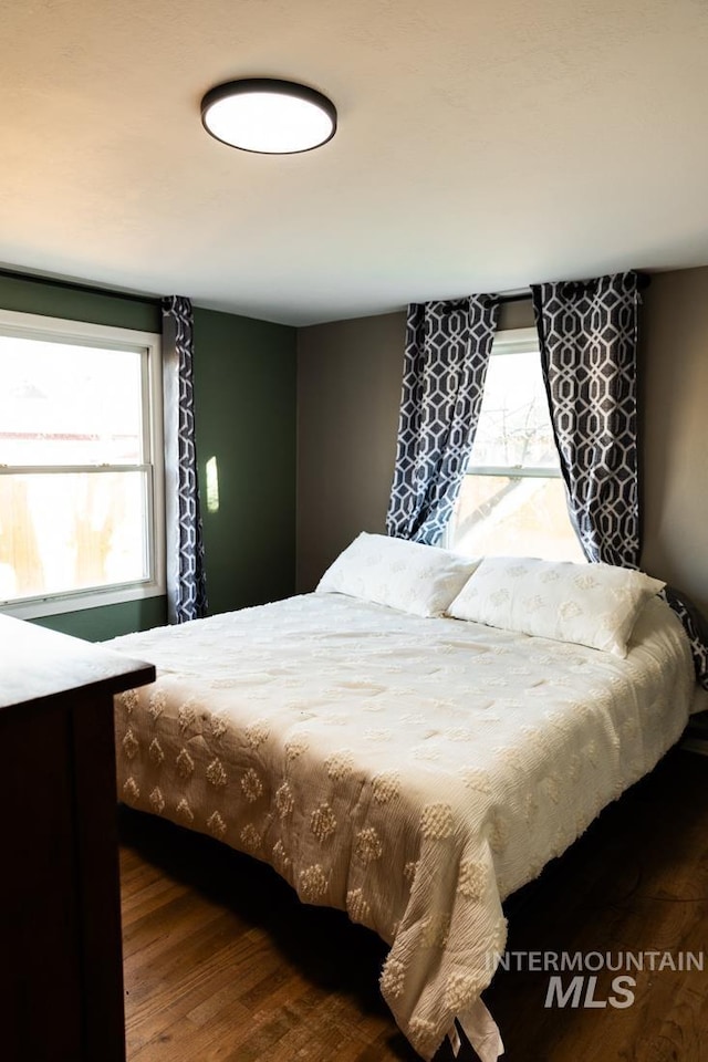 bedroom featuring wood finished floors