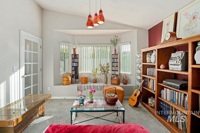 sitting room featuring carpet and vaulted ceiling