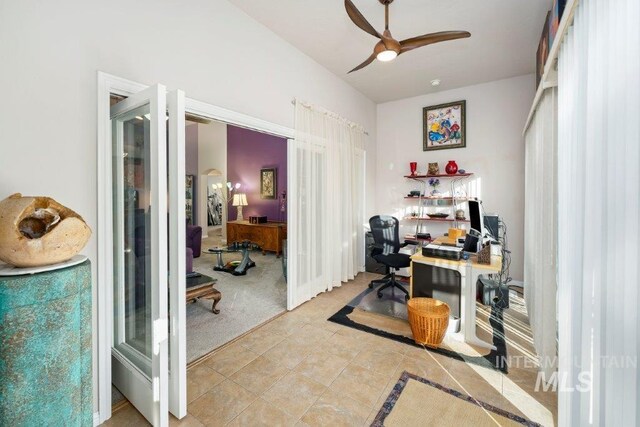 office area with light carpet and ceiling fan