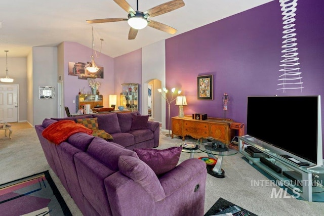 living room featuring carpet floors, high vaulted ceiling, and ceiling fan