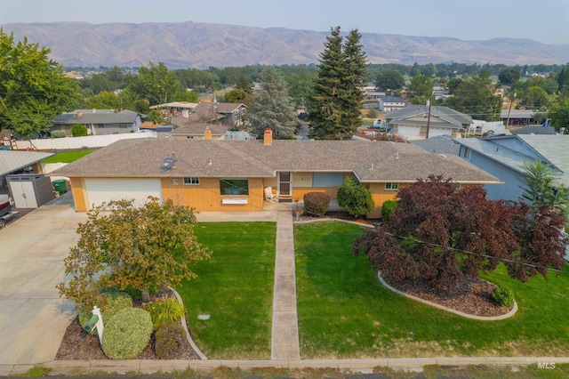 drone / aerial view featuring a mountain view