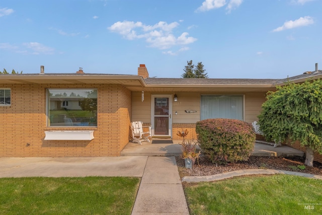 ranch-style house with a front yard