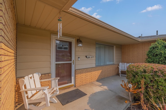 entrance to property featuring a patio