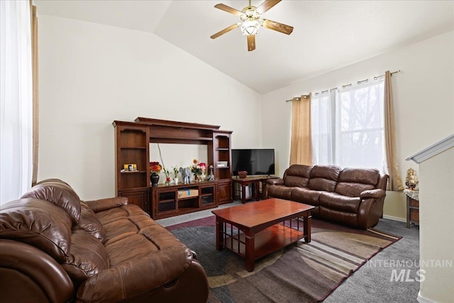 living area with carpet flooring, lofted ceiling, and ceiling fan