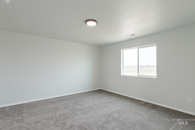 unfurnished room featuring carpet floors