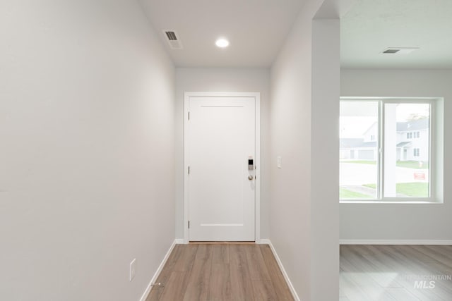 hallway featuring light hardwood / wood-style flooring