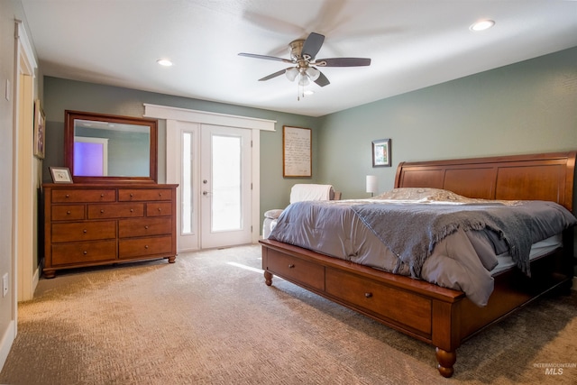 carpeted bedroom featuring access to outside, ceiling fan, and french doors