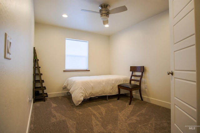 unfurnished bedroom with dark colored carpet and ceiling fan