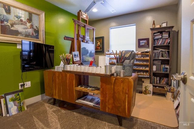 office with carpet floors and ceiling fan