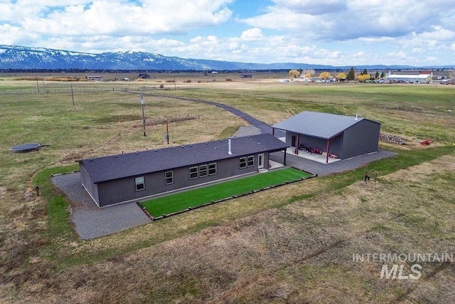 bird's eye view with a mountain view and a rural view