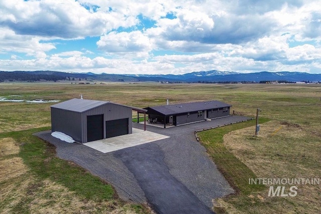 aerial view with a mountain view and a rural view