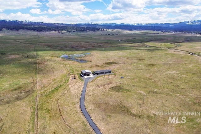 drone / aerial view featuring a mountain view