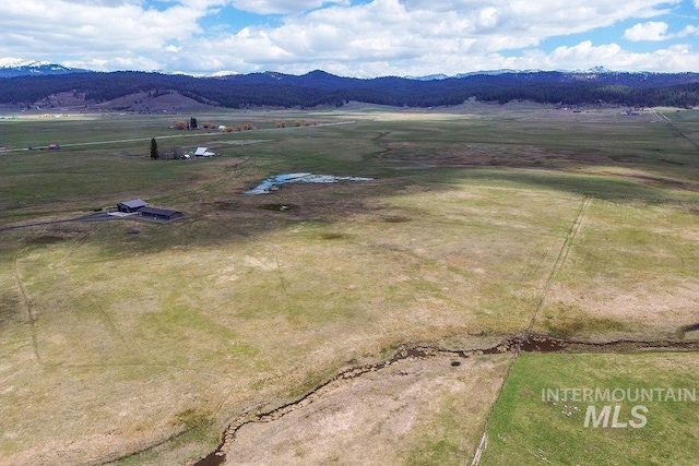 birds eye view of property with a rural view and a mountain view