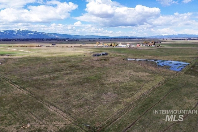 drone / aerial view with a mountain view and a rural view