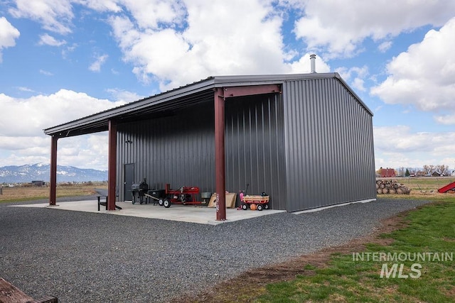 view of outdoor structure featuring an outbuilding and a mountain view
