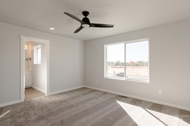 4403 N Magical Creek Ave, Meridian, ID 83646 - unfurnished bedroom with multiple windows, visible vents, baseboards, and light carpet