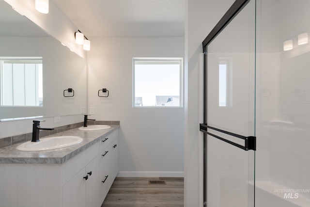 4403 N Magical Creek Ave, Meridian, ID 83646 - full bath with a shower stall, visible vents, wood finished floors, and a sink