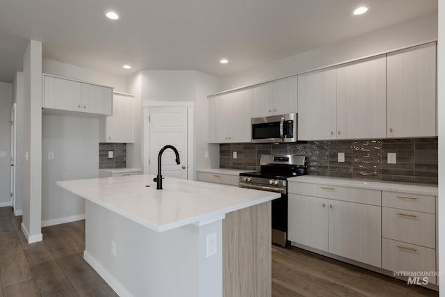 4403 N Magical Creek Ave, Meridian, ID 83646 - kitchen with light countertops, dark wood-style floors, a sink, and appliances with stainless steel finishes