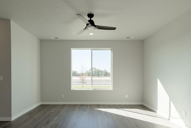 4403 N Magical Creek Ave, Meridian, ID 83646 - unfurnished room featuring wood finished floors, visible vents, baseboards, a textured ceiling, and ceiling fan