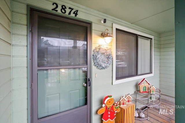 doorway to property featuring a porch