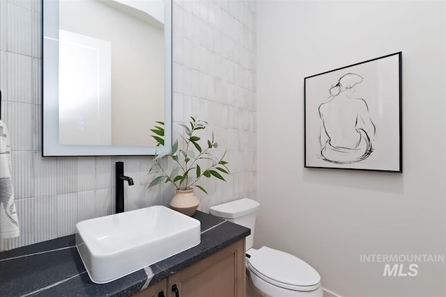 9989 W Bouvardia St, Star, ID 83669 - half bathroom with tile walls and vanity