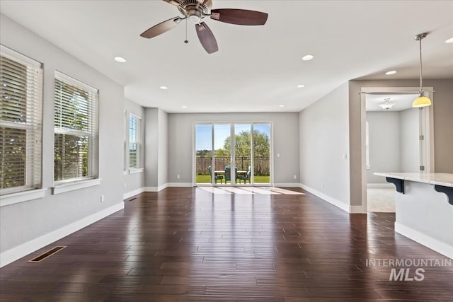 3631 S Pheasant Tail Way, Boise, ID 83716 - unfurnished living room with dark wood-style flooring, recessed lighting, a ceiling fan, and baseboards