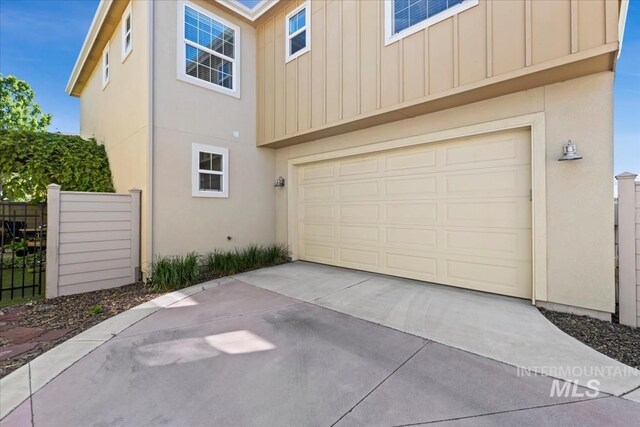 3631 S Pheasant Tail Way, Boise, ID 83716 - garage featuring driveway and fence
