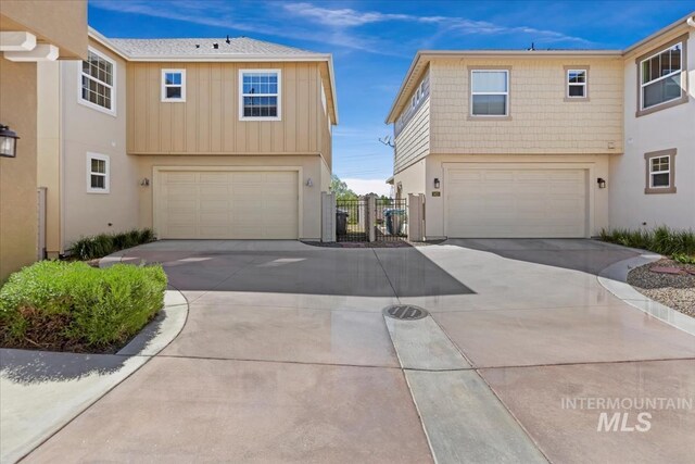 3631 S Pheasant Tail Way, Boise, ID 83716 - view of front of house with an attached garage, driveway, and fence