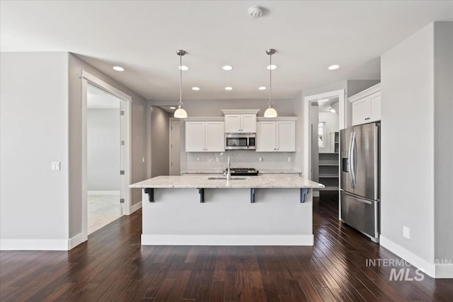 3631 S Pheasant Tail Way, Boise, ID 83716 - kitchen with stainless steel appliances, white cabinets, dark wood finished floors, and recessed lighting