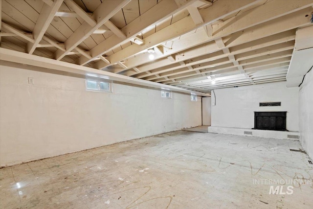 below grade area featuring visible vents and a fireplace