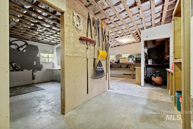 hall with concrete flooring