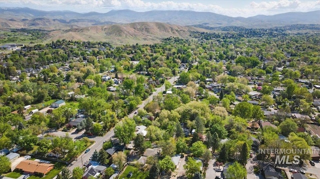 birds eye view of property with a mountain view