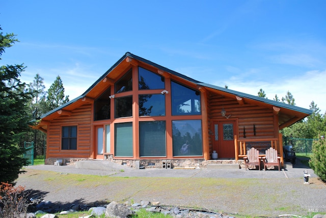 back of house with log siding