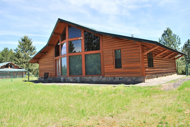 view of home's exterior featuring fence