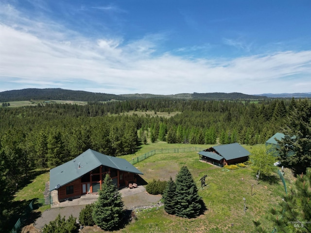 view from above of property with a heavily wooded area