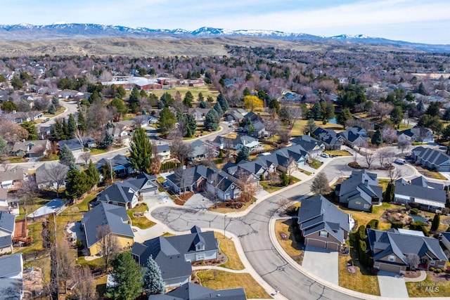 view of property location featuring a mountainous background and nearby suburban area