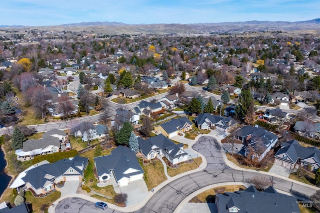 view of property location featuring nearby suburban area and mountains