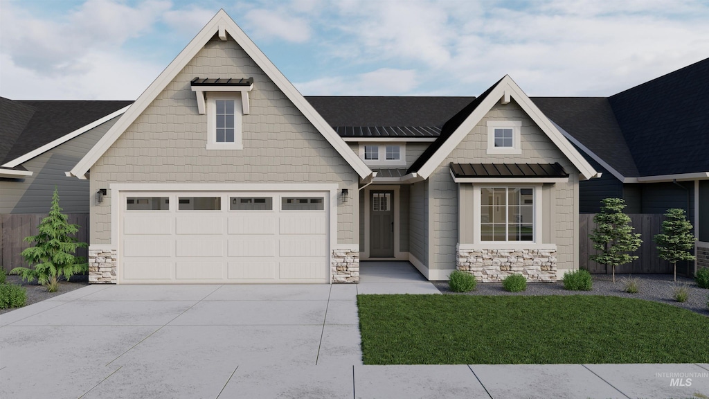 view of front of house with a garage and a front lawn