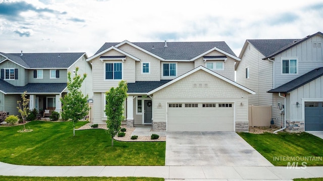 8228 S Bogus Ridge Ave, Boise, ID 83716 - craftsman-style house with concrete driveway, stone siding, a front yard, a garage, and roof with shingles
