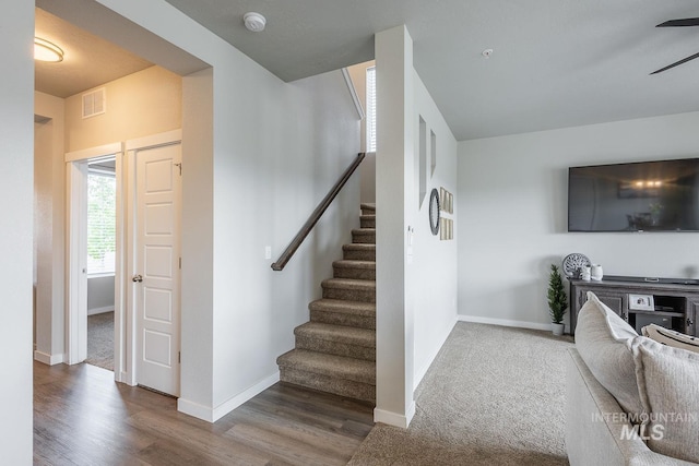 8228 S Bogus Ridge Ave, Boise, ID 83716 - stairs featuring a ceiling fan, wood finished floors, and baseboards