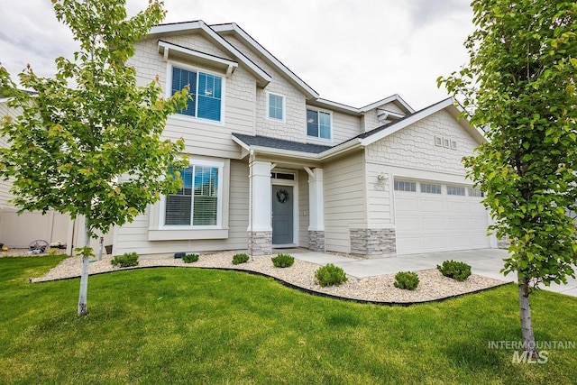 8228 S Bogus Ridge Ave, Boise, ID 83716 - craftsman house featuring a garage, a front yard, and stone siding