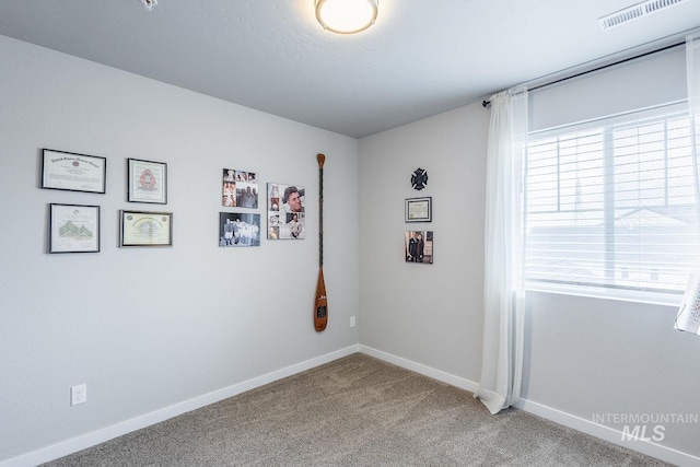 8228 S Bogus Ridge Ave, Boise, ID 83716 - carpeted empty room featuring healthy amount of natural light and baseboards