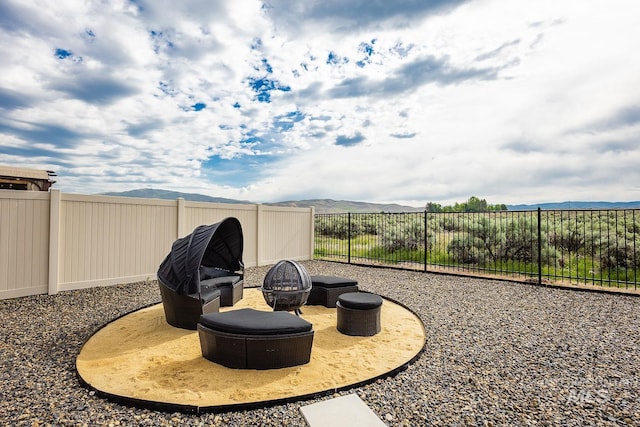 8228 S Bogus Ridge Ave, Boise, ID 83716 - fenced backyard with a fire pit and a mountain view