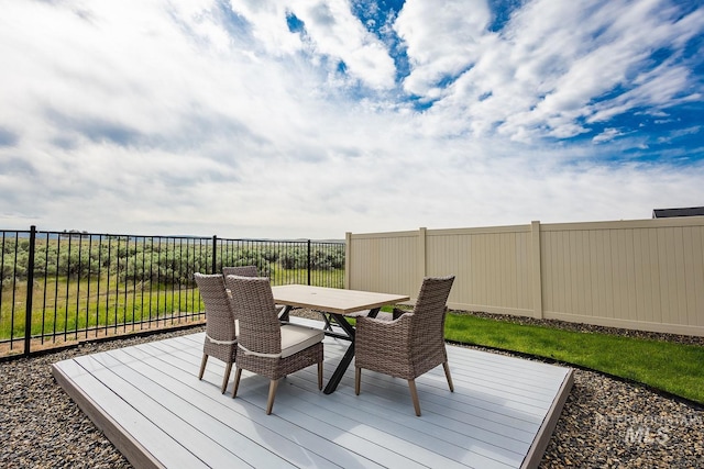 8228 S Bogus Ridge Ave, Boise, ID 83716 - wooden deck with outdoor dining space